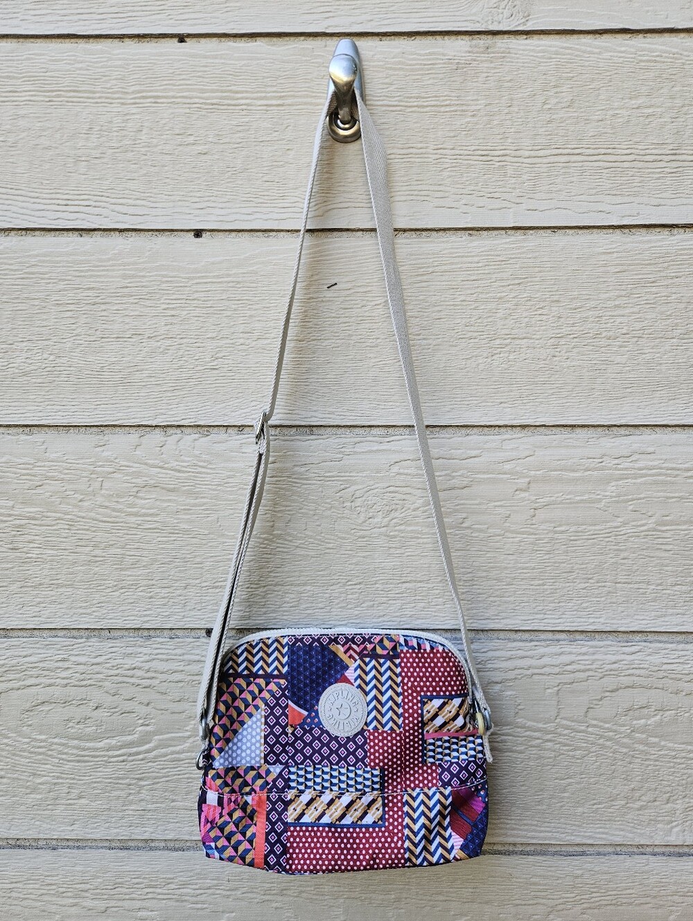 Kipling multicolor patchwork pattern dome crossbody bag
